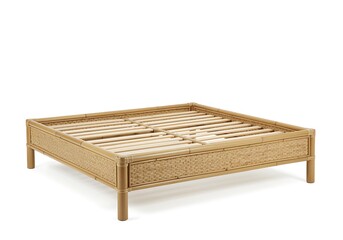 Natural rattan bed frame with slatted base on white background