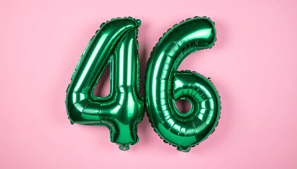Floating shiny green foil balloon number 46 in pink backdrop, soft glowing light.
