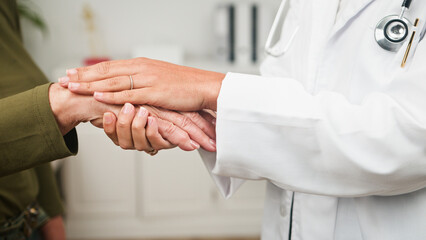 Fototapeta premium Compassionate Doctor Offers Gentle Support To Patient With Shared Hands And Care