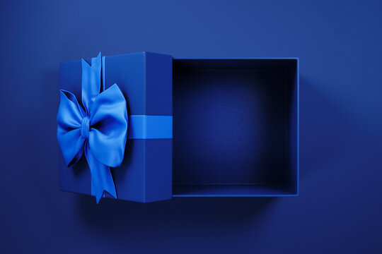 Top view of blue gift box with ribbon for business, holiday and celebration present. Open giftbox empty for luxury product placement mockup template. Christmas, new year, black friday shopping sale
