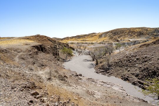 Dry river valley with basalt rocks, rock formation Organ Pipes, Damaraland, Kunene, Namibia