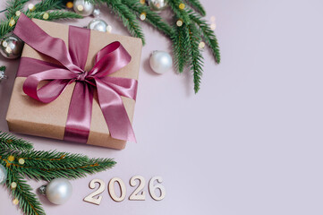 Gift box with bow and fir branches, Christmas decorations