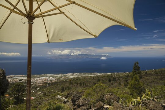 Panorama from Mirador de Chirche over Guia de Isora and Playa de San Juan to the west coast, with the island of Gomera in the background, Tenerife, Canary Islands, Spain