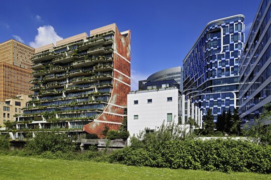 Left residential building The George, architects dok, right office building NautaDutilh by architects UN studio, Zuidas financial district, Amsterdam, North Holland, Netherlands