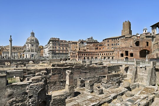 View of historic Traian's Forum Forum of Traian Foro Traiano from antiquity with building in semicircle at the back with colonnade in the foreground forecourt open space with column fragments remains of marble columns, Rome, Lazio, Italy