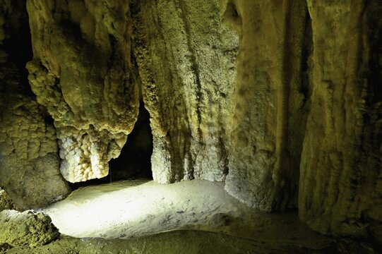 Stalactites illuminated by coloured LED light, stalactite cave, H&ouml;llgrotten, Baar, Canton Zug, Switzerland