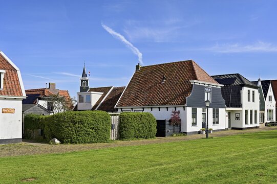 Typical row of houses with sailor's church, Oudeschild, Texel, Holland, Netherlands