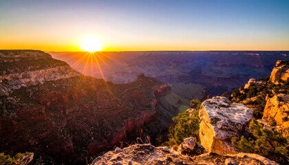 Fototapeta premium A stunning vista of a canyon at sunrise, with deep gorges, rock formations, and a golden sun radiating light. Lush vegetation on the edges