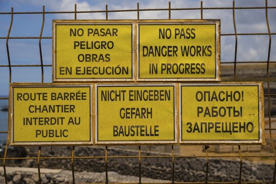 Multilingual signs, spelling mistakes, construction site, Tenerife, Canary Islands, Spain