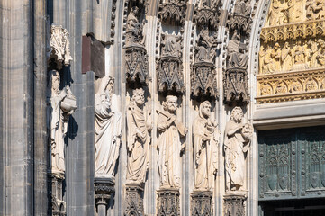 Architectural Detail with Sculptures at Entrance of Cologne Cathedral, Germany. Close Up.