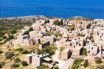 Flying over old village on Greek Chios island, ancient architecture. Aerial view