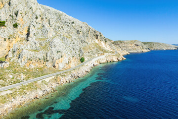 Aerial view of the coastline windy road, along the shore on Greek island