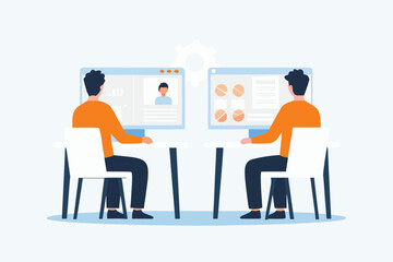 Two people sitting at desks working on computers displaying charts and profile information