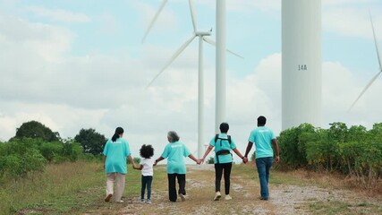 Volunteers are walking behind a windmill farm, volunteer charity people. charity community service event, ngo business and outreach, Group Diverse people meeting at park for donation
