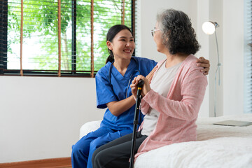 A Caring Hand: A compassionate caretaker provides support and comfort to an elderly woman, fostering a sense of trust and companionship in a tranquil setting.