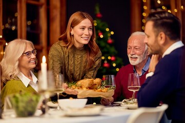 Warm Holiday Dinner With Family And Friends Sharing Food Around A Festive Table Together