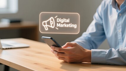 Businessman hand using smartphone with glowing floating digital marketing text and megaphone icons in cozy workspace, marketing strategy, ad performance