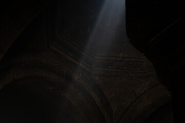 church interior, light falls into a dark room