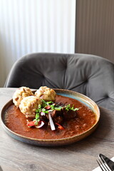 Traditional venison goulash served on a table in a restaurant, delicious autumn Czech dish, rich and hearty comfort food.