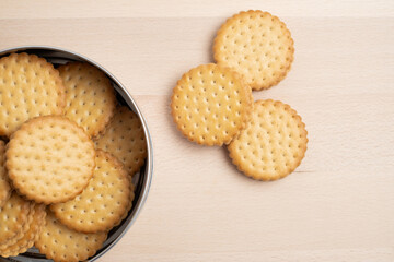 Cookies in a metal box on a light background. Homemade cookies in eco-friendly packaging. Composition for branding, delivery, or catering concepts. Sweet snack.

