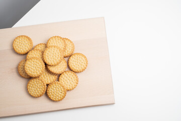 Sandwich cookies, cookies with chocolate cream filling in a crust. A modern cookie and packaging concept. A sweet snack and holiday concept.