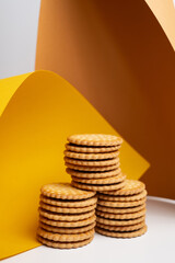 Sandwich cookies, cookies with chocolate cream filling in a crust. A modern cookie and packaging concept. A sweet snack and holiday concept.