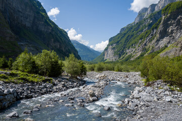 This landscape photo was taken in Europe, France, Auvergne-Rhone-Alpes, Haute-Savoie, Sixt-Fer-a-Cheval, in summer. It shows the hiking trail in the mountains of the Cirque du Fer-a-Cheval