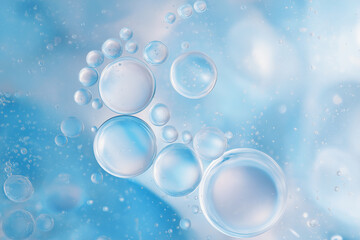 透明感のある青い泡が浮かぶ美容成分の背景素材。ヒアルロン酸やセラミドを連想させる保湿・スキンケアのマクロイメージ。／
Transparent blue cosmetic ingredient bubbles background, high-resolution macro image reminiscent of hyaluronic acid and ceramide for skincare