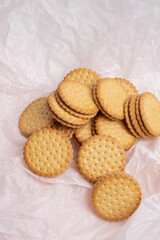 Sandwich cookies, cookies with chocolate cream filling in a crust. A modern cookie and packaging concept. A sweet snack and holiday concept.