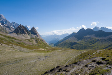 Fototapeta premium This landscape photo was taken in Europe, France, Auvergne Rhone Alpes, Haute Savoie, in summer. We can see the Col de la Seigne, under the Sun.