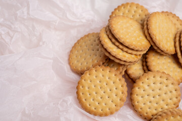 Sandwich cookies, cookies with chocolate cream filling in a crust. A modern cookie and packaging concept. A sweet snack and holiday concept.