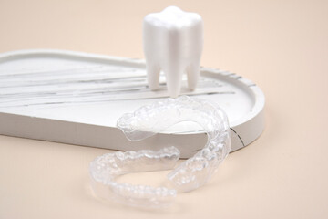 The transparent mouth guards for teeth at night after wearing braces.