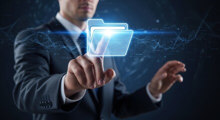 Businessman in a suit pointing at a glowing virtual folder icon, representing digital data management and modern technology.