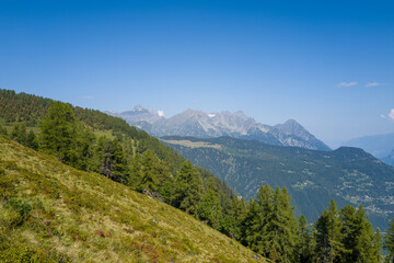 This landscape photo was taken in Europe, France, Auvergne Rhone Alpes, Haute Savoie, in summer. We can see the mountains, under the Sun.