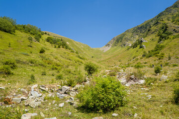 This landscape photo was taken in Europe, France, Auvergne Rhone Alpes, Haute Savoie, in summer. We can see the Tricot pass, under the Sun.