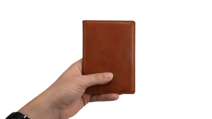 man hand holding brown notebook. Isolated on transparent background, png