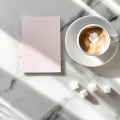 A white coffee cup with a heart on it sits on a table next to a blank piece of paper. The cup is filled with coffee and has sugar cubes in it. The scene suggests a moment of relaxation