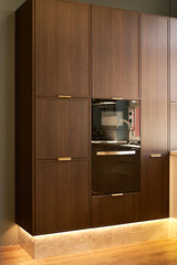 Modern kitchen with sleek microwave and stylish wooden cabinetry