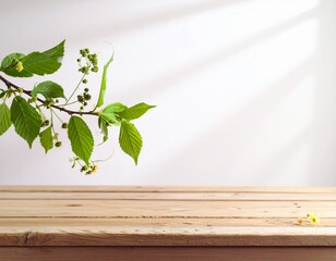 Nature's Fresh Green Leaves Display on Wooden Table with Sunlit Background