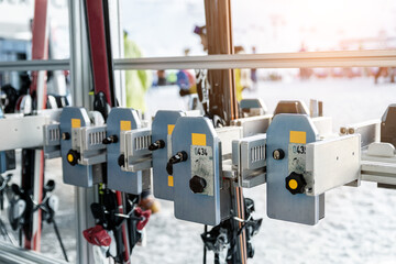 Many ski snowboard storage locker coin cells at peak entrance of station of cabin gondola ski lift at mountain alpine luxury austrian winter resort. Comfort service and facilities for tourists skiers