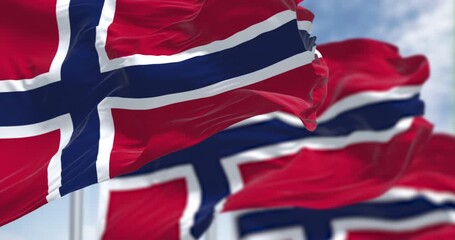 Norway national flags waving in the wind on a clear day