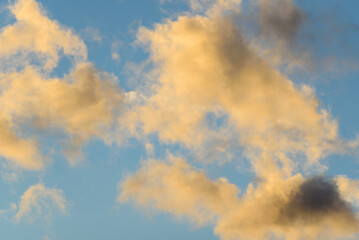 Golden Illuminated Clouds at Sunset