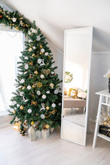 Christmas interior of a bright living room. The attic. Daytime