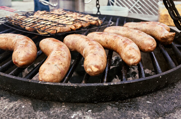 Delicious and Flavorful Grilled Sausages Cooking on the Barbecue Grill, Perfect for Gatherings