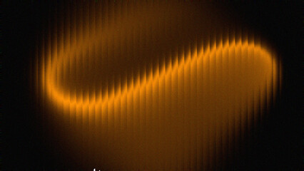 Abstract swirling orange light pattern on black background