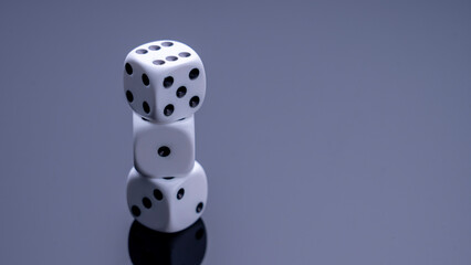 Dice on a mirrored background, concept. High quality photo