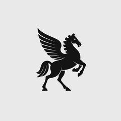 Fototapeta premium Black silhouette of a majestic Pegasus, a mythical winged horse rearing, an iconic symbol from ancient Greek mythology, isolated on a clean background.
