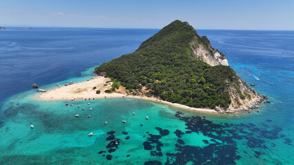 Aerial drone photo of scenic small paradise island of Marathonisi or Turtle island in bay of Laganas featuring a sandy beach where Caretta Caretta turtle eggs hatch, Zakynthos island, Ionian, Greece 