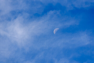 Daytime Sky with Half Moon and Clouds