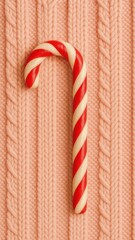 Obraz premium Candy cane on knitted mobile wallpaper